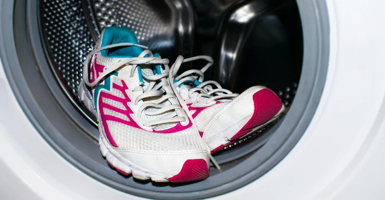 Pair of sports shoes in washing machine