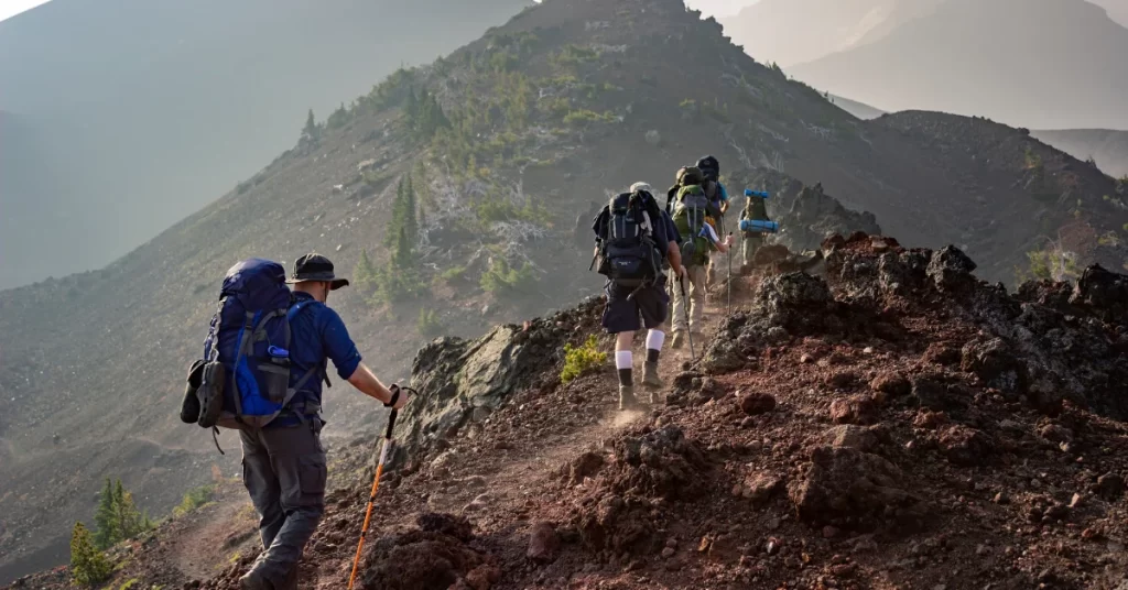  A group of hikers climbing a mountain trail. 