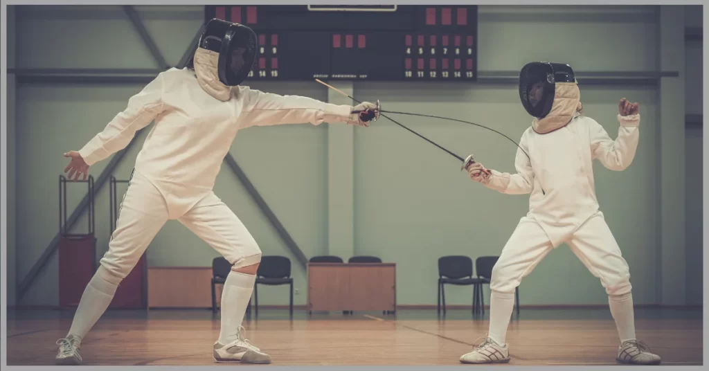 two fencers in full gear engaged in a bout. (sports beginning with F)