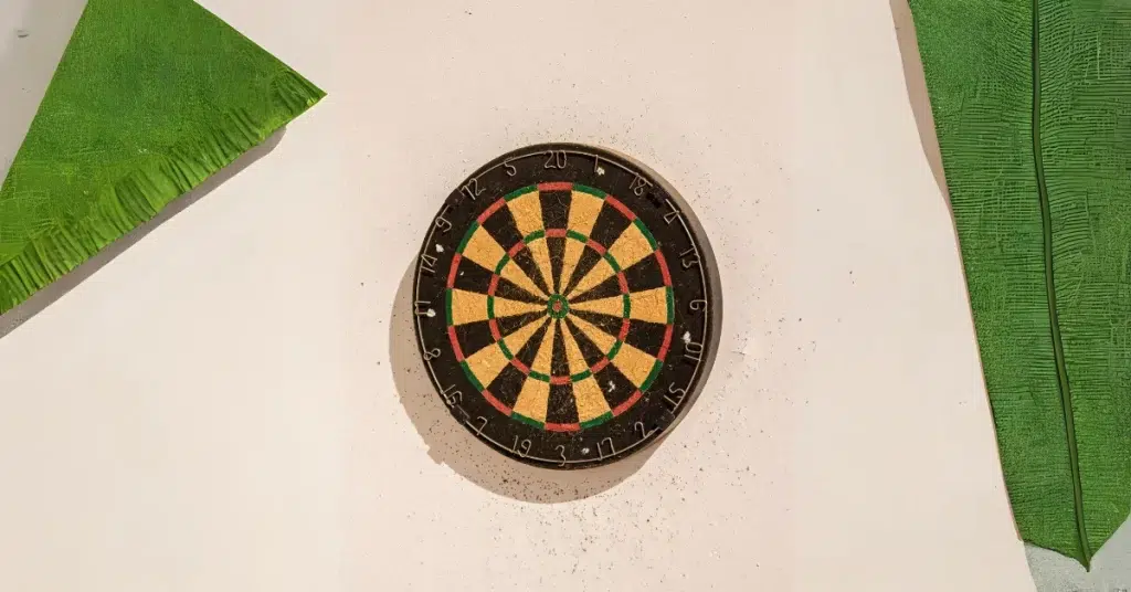 A dartboard mounted on a wall. (Easy Dart Games)