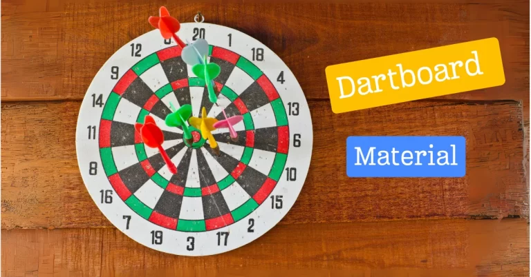 A dartboard with multiple colorful darts stuck in it, hanging on a wooden wall. Two labels reading “Dartboard” and “Material” are present beside the dartboard.